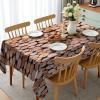 Ambesonne Christmas Tablecloth, New Year’s Eve Tree Branch Border with Berry Ribbons Gingerbread Man, Dining Room Kitchen Rectangular Table Cover, 60″ X 84″,Brown(Cream)