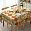 Ambesonne Christmas Tablecloth, New Year’s Eve Tree Branch Border with Berry Ribbons Gingerbread Man, Dining Room Kitchen Rectangular Table Cover, 60″ X 84″,Brown(Orange Yellow)